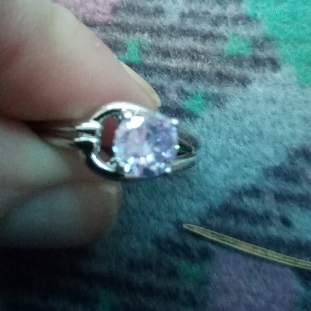 Silver ring with light purple stone
